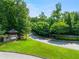 Gated community entrance with stone pillars and lush landscaping at 3016 Sunset Pass, Canton, GA 30114