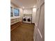 Laundry room with washer, dryer, built-in shelves, and hardwood floors at 4108 John Alden Ct, Stone Mountain, GA 30083