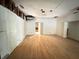 Large room with hardwood floors undergoing renovation at 1809 Silver Ridge Ct, Stone Mountain, GA 30087