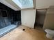 Bathroom with dark tile shower and skylight at 1809 Silver Ridge Ct, Stone Mountain, GA 30087