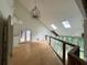 High ceiling loft area with hardwood floors and chandelier at 1809 Silver Ridge Ct, Stone Mountain, GA 30087