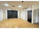 Unfinished basement with hardwood floors and a feature wall at 1809 Silver Ridge Ct, Stone Mountain, GA 30087
