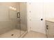 Modern bathroom with a large walk-in shower and built-in seat at 2401 Siskin Square Rd, Duluth, GA 30096