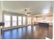 Open concept Gathering room with hardwood floors, fireplace, and kitchen view at 2421 Siskin Square Rd, Duluth, GA 30096