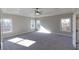 Spacious main bedroom with carpeted floor and abundant natural light at 2421 Siskin Square Rd, Duluth, GA 30096