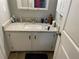 Bathroom with granite countertop and white cabinets at 1189 Ashborough Se Dr # J, Marietta, GA 30067