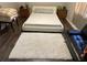 Bedroom with a white platform bed and fluffy rug at 1189 Ashborough Se Dr # J, Marietta, GA 30067