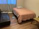 Bedroom with a twin bed and a black couch at 1189 Ashborough Se Dr # J, Marietta, GA 30067