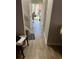 Hallway with wood-look tile flooring leading to the backyard at 1189 Ashborough Se Dr # J, Marietta, GA 30067