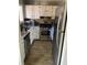 Galley kitchen with stainless steel appliances and granite countertops at 1189 Ashborough Se Dr # J, Marietta, GA 30067