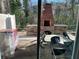 Outdoor patio with brick fireplace and seating area at 1189 Ashborough Se Dr # J, Marietta, GA 30067