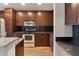 Modern kitchen with stainless steel appliances and wooden cabinetry at 860 Peachtree Ne St # 1010, Atlanta, GA 30308