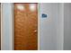 Apartment building entry door with wood finish and apartment number 1010 at 860 Peachtree Ne St # 1010, Atlanta, GA 30308