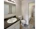 Clean bathroom with white vanity and gray countertop at 1472 Pine Log Ne Rd, Conyers, GA 30012