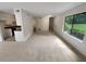 Bright living room with carpeting and view to kitchen and patio at 1472 Pine Log Ne Rd, Conyers, GA 30012