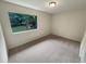 Bright bedroom with neutral walls and carpet at 1472 Pine Log Ne Rd, Conyers, GA 30012