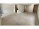 Open living room with view into kitchen and stairs at 1472 Pine Log Ne Rd, Conyers, GA 30012