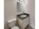 Simple bathroom with white toilet and vanity at 1472 Pine Log Ne Rd, Conyers, GA 30012