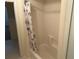 Clean bathroom with shower and floral shower curtain at 265 Regal Dr, Lawrenceville, GA 30046
