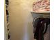 Neatly organized closet with shelving and hanging space for clothes at 265 Regal Dr, Lawrenceville, GA 30046