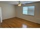 Large bedroom with hardwood floors and window with blinds at 265 Regal Dr, Lawrenceville, GA 30046