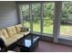 Sunroom with wicker furniture and brick flooring at 265 Regal Dr, Lawrenceville, GA 30046