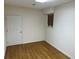 Simple, bright bedroom with hardwood floors and neutral walls at 265 Regal Dr, Lawrenceville, GA 30046