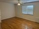 Spacious bedroom featuring hardwood floors and a ceiling fan at 265 Regal Dr, Lawrenceville, GA 30046