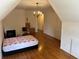 Spacious bedroom with hardwood floors, chandelier, and window at 265 Regal Dr, Lawrenceville, GA 30046