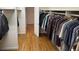 Spacious walk-in closet with custom shelving and hanging rods at 265 Regal Dr, Lawrenceville, GA 30046