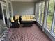 Sunroom with patio furniture and brick floor at 265 Regal Dr, Lawrenceville, GA 30046