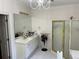 Bathroom with double vanity, large mirror, and separate shower at 265 Regal Dr, Lawrenceville, GA 30046