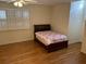 Bright bedroom with hardwood floors and a charming window at 265 Regal Dr, Lawrenceville, GA 30046