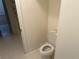 Simple bathroom with toilet and tiled floors at 265 Regal Dr, Lawrenceville, GA 30046