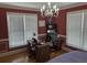 Home office with built-in shelving, hardwood floors, and window seating at 265 Regal Dr, Lawrenceville, GA 30046