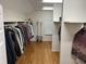 Large walk-in closet with ample hanging and shelving space at 265 Regal Dr, Lawrenceville, GA 30046