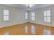 Bright bedroom featuring hardwood floors and plantation shutters at 265 Regal Dr, Lawrenceville, GA 30046