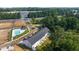 Aerial view of townhomes, pool, and surrounding landscape at 348 Elgin Dr # 162, Lawrenceville, GA 30045