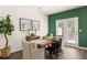 Dining area with wood table and access to backyard at 348 Elgin Dr # 162, Lawrenceville, GA 30045