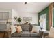 Living room with neutral palette and view into dining and kitchen at 348 Elgin Dr # 162, Lawrenceville, GA 30045