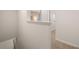 Bright hallway with a half wall and carpeted floors at 348 Elgin Dr # 162, Lawrenceville, GA 30045