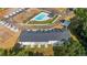 Aerial view of townhomes, community pool, and parking at 348 Elgin Dr # 162, Lawrenceville, GA 30045