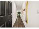 Bright entryway with hardwood floors, black door, and gold mirror at 348 Elgin Dr # 162, Lawrenceville, GA 30045