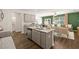 Open concept kitchen with island, granite countertops, and stainless steel appliances at 348 Elgin Dr # 162, Lawrenceville, GA 30045