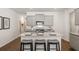 Modern kitchen with island, granite countertops and stainless steel appliances at 348 Elgin Dr # 162, Lawrenceville, GA 30045