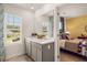 Well-lit bathroom with double vanity and a view from the window at 348 Elgin Dr # 162, Lawrenceville, GA 30045