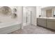 Bathroom with soaking tub, shower, and double vanity at 328 Elgin Dr, Lawrenceville, GA 30045