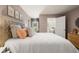 Bedroom with queen bed, soft pink walls, and natural light at 328 Elgin Dr, Lawrenceville, GA 30045
