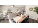 Open dining area with wood table and view into living room at 328 Elgin Dr, Lawrenceville, GA 30045