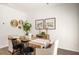 Bright dining area featuring a wood table and neutral decor at 328 Elgin Dr, Lawrenceville, GA 30045